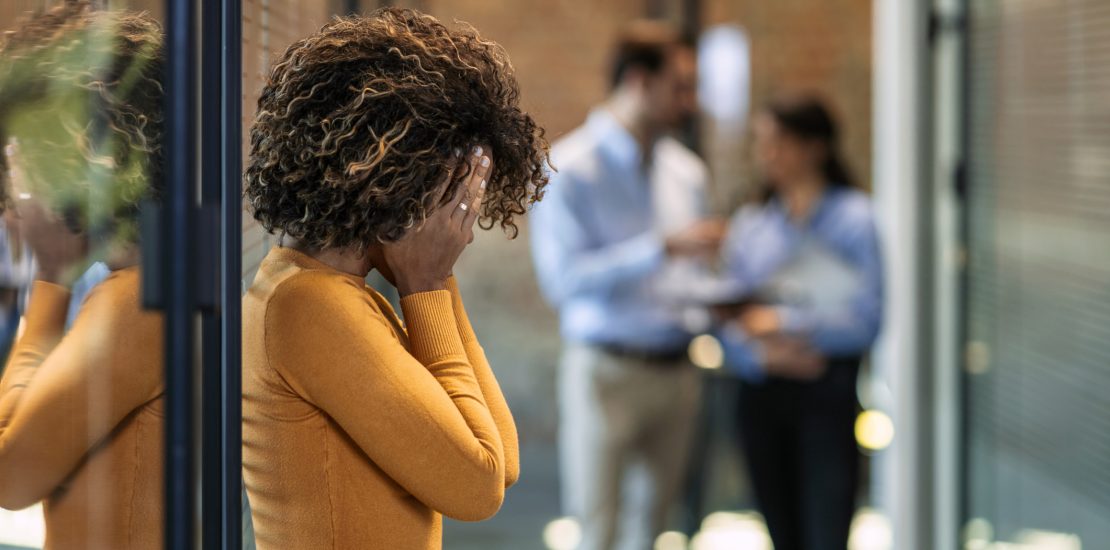 Photo of female Worker having headache. Dark-haired office worker having headache after been fired from work for no reason.