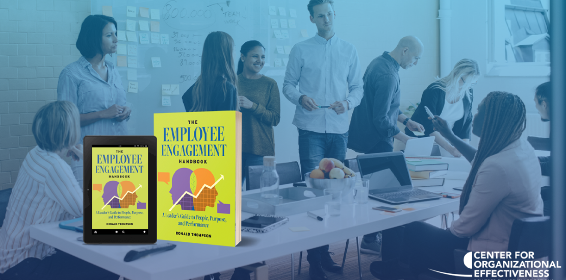 The Employee Engagement Handbook in the foreground and a corporate team in the background.